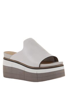 Discounts cannot be applied to this product Slide in to the effortless direction of Flow in mist. This soft leather sandal features an uncomplicated silhouette, designed to fit simply into an affluent wardrobe of modern style. The multi tone lightweight platform gives it a subtle athleisure twist while maintaining its enchanting boho style. Features:- Women's slip-on sandal- Crafted with genuine leather- Inked leather edges- Luxury athleisure and boho style- Foam padded sock- 2.87" Layered EVA s Luxury Athleisure, Soft Leather Sandals, Yellow Daffodils, Slide In, Heeled Sandals, Modern Woman, Boho Style, Platform Sandals, Slip On Sandal