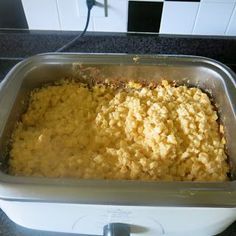 a casserole dish is sitting on top of the stove and ready to be cooked