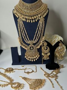 an assortment of gold jewelry on display