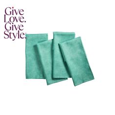 three teal colored towels with the words give love, give style on them and one is