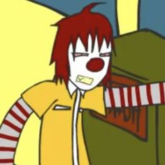 a person with red hair and clown makeup holding a box in front of their face