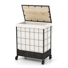 a black and white basket on wheels with a wooden box in the top section,