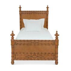 a wooden bed with white sheets and pillows on it's headboard, against a white background