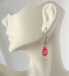 Faceted Pink Dangle Earrings 1.5” in length, pretty pink and shiny silvery bead caps make these stainless steel earrings a delightful spring and summer accent. Made with glass beads and silver-layered bead caps, and stainless steel, nickel-free ear-hooks. These Faceted Pink Dangle Earrings will ship to you in a gift box, securely mailed in a padded envelope. Shipping same or next day, thru USPS Ground Advantage, tracking and insurance included. Once mailed, you can track your package at USPS.com Dangle Beaded Earrings With Czech Glass, Dangle Czech Glass Beaded Earrings, French Hook Beaded Drop Earrings, Czech Glass Teardrop Dangle Earrings With Ear Wire, Czech Glass Crystal Dangle Earrings, Hypoallergenic Czech Glass Dangle Earrings, Czech Glass Crystal Earrings With Ear Wire, Czech Glass Beaded Earrings For Pierced Ears, Adjustable Czech Glass Crystal Earrings