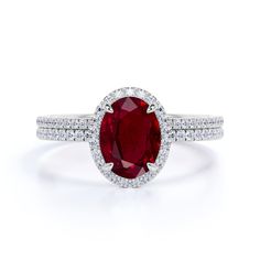 This is an antique design 2 Carat Oval Cut Ruby and Diamond Halo Bridal Ring Set in White Gold. The bridal ring set is made with natural Ruby, real diamonds and on real gold. The Ruby bridal ring set can be made in either Rose, White or Yellow Gold, and can be customized to your choice of 10k, 14k or 18k Gold. As alway Luxury Silver Ruby Ring With Halo Setting, Luxury Classic Style Lab-created Ruby Ring, Luxury White Gold Ruby Ring With Halo Setting, Luxury Oval Lab-created Ruby Diamond Ring, Luxury Oval Ruby Ring With Halo Setting, Luxury Formal Lab-created Ruby Diamond Ring, Luxury Lab-created Ruby Diamond Ring, Luxury Lab-created Ruby Ring With Diamond Accents, Luxury White Gold Ring With Lab-created Ruby