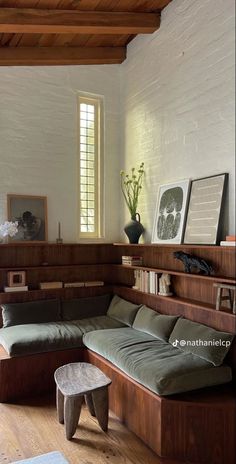 a living room filled with furniture next to a window