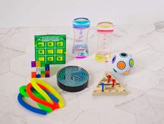 there are many different items on the table to be used in this project, such as toys and games