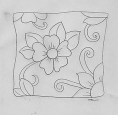 a drawing of a flower with swirls and leaves in the center on a piece of paper