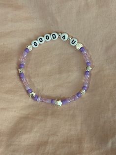 A hand-crafted glass bead friendship bracelet highlighting Olivia Rodrigo's song "Good 4 U"! A simple and cute way to show off your favorite song or a great concert accessory!  This bracelet is made with Czech glass beads, plastic letter beads, plastic spacer beads, and is on an elastic thread measured at about 10 inches in length for a relaxed/loose fit. If you would like the bracelet you order to be smaller or larger, please leave the requested size in inches in the personalization box!  All bracelets are made to order and are typically shipped out within 1-3 business days unless otherwise stated. Adjustable Kpop Style Friendship Bracelets With Letter Beads, Kpop Style Adjustable Beaded Bracelet For Birthday, Adjustable Beaded Kpop Bracelets, Olivia Rodrigo Friendship Bracelet, Olivia Rodrigo Merch, Plastic Letters, Friendship Bracelets With Beads, Resin Bracelet, Friendship Bracelet