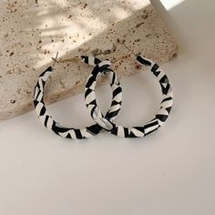 Black And White Leather Oval Hoop Earrings. Black Round Summer Jewelry, Trendy Small Black Hoop Earrings, Modern Black Jewelry For Summer, Modern Black Summer Jewelry, Chic Black Hoop Earrings, Trendy White Round Hoop Earrings, Black Hoop Jewelry For Summer, Summer Black Hoop Jewelry, Chic Small White Hoop Earrings