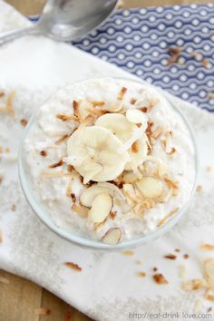 a bowl of oatmeal topped with bananas and nuts