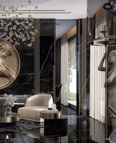 an elegant living room with black marble and gold accents