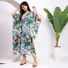 Green Dress | Cotton Kaftan Dress | Windham Paradiso | Long Kaftan | Beach Coverup | Summer Wear Caftan | Bridesmaid Gown | Plus Size Dress Step into summer with our Green Dress, a versatile cotton kaftan featuring a Windham Paradiso print. This long kaftan serves as a stylish beach cover-up or summer wear caftan, perfect for plus-size figures and as a bridesmaid gown.  About the dress: The dress is made in a beautiful hand block print and 100% pure cotton fabric. Extremely comfortable fit, eleg Green V-neck Free Size Kimono, Green Printed V-neck Kaftan, Green V-neck Printed Kaftan, Green Floral Print Maxi Kaftan, Green Flowy V-neck Kimono, Green Floral Print Tunic Kaftan, Green V-neck Kimono For Vacation, Green Maxi Dress With Kimono Sleeves, Green V-neck Kaftan For Vacation