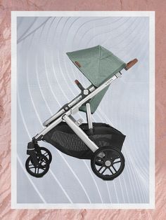 an image of a baby stroller with wheels on the side and pink paper in the background