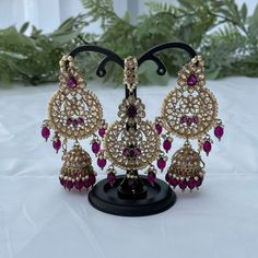 Kundan jewelry set includes a pair of earrings and a tikka. Colour: purple/plum Purple Kundan Jewelry Gift, Traditional Purple Jewelry For Festive Occasions, Elegant Purple Meenakari Jewelry, Traditional Purple Festive Jewelry, Purple Jewelry For Festivals And Celebrations, Festive Purple Chandbali Jewelry, Festive Purple Meenakari Jewelry, Purple Latkans Jewelry For Party, Traditional Purple Jewelry For Party