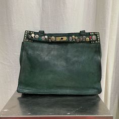 Made In Italy, Green Leather, Metal And Jewel Embellishments Comes With Longer Strap, Care Bag And Leather Cream 14 X 10 X 4 Inches Inside Zipper Pocket Green Shoulder Bag With Double Handle And Palladium Hardware, Green Shoulder Bag With Palladium Hardware For Shopping, Green Shoulder Bag With Palladium Hardware And Double Handle, Green Crossbody Bag With Palladium Hardware, Green Leather Bags With Brass Hardware, Green Shoulder Bag With Palladium Hardware For Everyday, Elegant Green Bags With Brass Hardware, Vintage Tote Bag With Palladium Hardware, Green Tote Shoulder Bag With Palladium Hardware