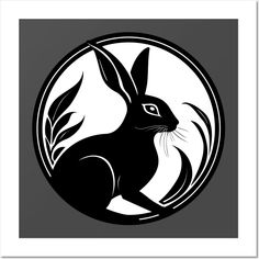 a black and white image of a rabbit in a circle with leaves on the side