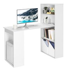 a white desk with a computer on it and some bookshelves in front of it