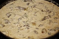 a pan filled with food sitting on top of a stove