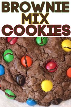 a close up of a cookie with m & m candies on it and the words brownie mix cookies