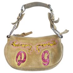 Early 2000s Dolce & Gabbana tan suede and python snake shoulder bag! Perfect for anytime of year. This bag has a tan / beige suede base with pink and yellow python skin on the front and back. Intricate stitching on both the front and back. Top zip closure with large interior zipped storage. Chic leopard print nylon lining. The perfect size bag to fit all your essentials. In great condition Made in Italy Measurements: 10 inches from side to side 6 inches from top of bag to bottom (not including s Yellow Python, 2000s Bags, Dolce And Gabbana Handbags, Structured Shoulder, Python Snake, Python Skin, Tan Bag, Adjustable Bag, Vintage Shoulder Bag