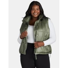 As temps begin to dip, transform your chilly weather wardrobe with Ozark Trails Sporty Puffer Vest. This easy-to-layer quilted vest is great for when its not quite cold enough for a heavyweight winter coat, but you still need a little more warmth than your jean jacket. Whether youre heading out on a hike, to walk your dog, or to get coffee, this stylish puffer vest is the perfect pick to complete your casual-cool look. Size: 1X.  Color: Green.  Gender: female.  Age Group: adult. Faux Fur Gilet, Fur Gilet, Quilted Puffer Vest, Ozark Trail, Chilly Weather, Quilted Vest, Body Warmer, Warm Jacket, Puffer Vest