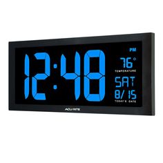 an alarm clock displaying the time in blue on a black frame against a white background