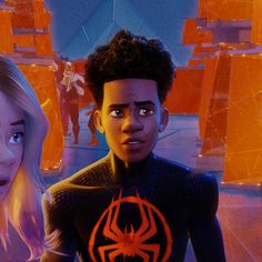 the spider - man and woman are standing together in front of an orange background with other people