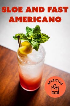 a close up of a drink on a table with the words sloe and fast americano