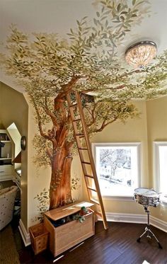 a tree painted on the ceiling in a child's room with a ladder up to it