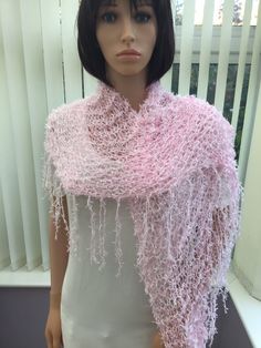 "This very pretty, lacy shawl is in shades of pink and white, with an ultra feminine look. It's light & gentle to wear, great for holidays ( easy to pack in a case!) & it's random colour mix means that no two are exactly the same. It would make a unique gift for any lady, good for wearing to an anniversary, wedding, etc, as it's so easy to pair up, with its gentle colour. Approx size - from top to point, 64cm (25\") x 158cm (62\") across, at the widest point. Hand or machine wash,  dry flat 65.5% polyester, 19% courtelle, 15.5% nylon I have been established for several years, & have won awards for my scarves, as they are so versatile & easy to wear. The shawls/wraps have evolved as a s result of customer requests, & have proved to be equally as popular. I have also been interviewed on loca One Size Pink Shawl For Spring, Pink Semi-stitched Shawl For Diwali, Pink Wedding Shawl For Spring, Pink Shawl Scarves For Spring, Pink Shawl Scarf For Spring, Elegant Fitted Pink Shawl, Spring Wedding Shawl In Pink, Pink One Size Shawl, Elegant Pink Shawl Scarves