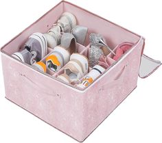 a pink suitcase filled with lots of pairs of shoes