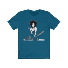 This is a High-Quality, Bella + Canvas 3001 Premium, Soft, Unisex, Short Sleeve Tee Shirt. Unisex T-shirt featuring 1970s, Funk, Soul Music and blues artist and icon for black women, Betty Davis. The image was created using a half-tone effect, which allows it to blend into the shirt as it is partly transparent, creating a stylish, versatile t-shirt suitable for almost any occasion - casual yet smart and stylish! This aesthetic tee would be an ideal gift for Soul, Funk, and RnB music fans, lovers Pop Culture Screen Print Tops For Concerts, Music-themed Graphic Short Sleeve Top, Music-themed Graphic Design Short Sleeve Top, Music-themed Concert Tops With Graphic Design, Fitted Concert T-shirt With Graphic Print, Music-themed Graphic Tops For Concerts, Fitted Graphic T-shirt For Concerts, Fitted Graphic Print T-shirt For Concert, Music-themed Graphic Top For Concert