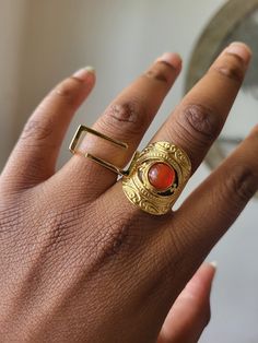 Gold statement ring  Red stone featured with detailed finishes  Stainless Steel Jewelry Drawing, Gold Statement Ring, Stone Feature, Geometric Ring, African Jewelry, Gold Geometric, Red Stone, Ring Gold, Statement Ring