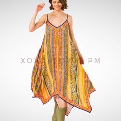 Yellow Orange Boho Print Midi Dress Shark Bite Hem V Neck Spaghetti Straps As Effortless As It Is Essential, This Everyday Boho Chic, Multi Color Hanky Dress Will Be Your Go To. It’s Luxuriously Soft, Light Weight, Stylish & On Trend. It Looks Great With A Denim Jacket & Boots Or Dressed Up With Heels. Features Relaxed Flowing Fit Multi Print, Multi Color Adjustable Spaghetti Straps V Neckline, Front & Back Flattering On Many Body Types Handkerchief Asymmetrical Hemline 100% Rayon Model In Green Multicolor Summer Slip Dress With Spaghetti Straps, Multicolor Spaghetti Strap Slip Dress For Summer, Multicolor Sleeveless Slip Dress For Summer, Bohemian Multicolor Midi Dress With Spaghetti Straps, Yellow Sleeveless Slip Dress, Yellow Midi Length Slip Dress, Yellow Summer Slip Dress With Spaghetti Straps, Yellow Midi Sundress For Vacation, Yellow Bohemian Summer Dress