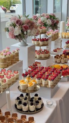 an assortment of desserts displayed on a table