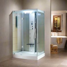 a bathroom with a walk in shower next to a bath tub