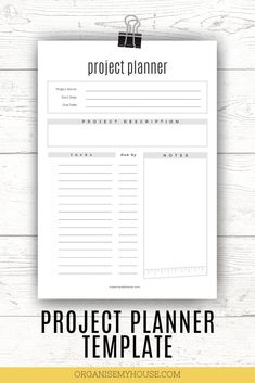 the project planner is shown on top of a white wooden table with text overlay