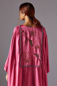 Pink kaftan kurta with a curved hemline which features metallic handwork, jacobean hand work in the shapes of nature in the front and back. Paired with dhoti in bamberg satin which has an asymmetrical hemline with handworked metallic button and loop closure.
Components: 2
Pattern: Embroidered
Type Of Work: landscape jacobean
Neckline: Notched
Sleeve Type: Flared
Fabric: Bamberg Satin
Color: Pink
Other Details: 
Asymmetric
Attached lining
Occasion: Cocktail - Aza Fashions Pink Kaftan, Kaftan Kurta, Types Of Work, Satin Color, Hand Work, Set For Women, Aza Fashion, Fashion Set, Sleeve Type