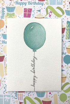 a birthday card with a green balloon on it