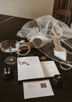 a table topped with jewelry and wedding rings