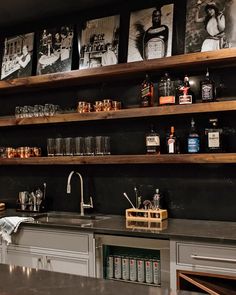 a kitchen with shelves filled with bottles and glasses