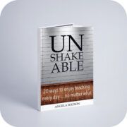 the book unshake able is sitting on top of a white surface with a brick wall in the background