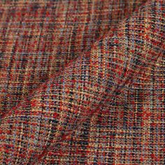 the fabric is made up of different colored tweeds and has an interesting pattern on it