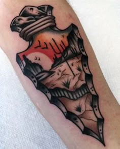 a man's arm with a tattoo design on it