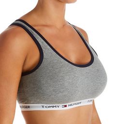 Casual, cute, and comfy - what more could you want? This soft cotton bralette stands out with cool contrast and logo details, perfect for lounging or chilling out. Made from cotton and spandex. Wireless, seamless cups are unlined (unpadded), with a double layer cotton body. Scoop neckline has contrast, covered elastic at the edge for a closer fit. Center - tall center panel for more coverage. Wide, exposed elastic underband adds stability and has the repeating Tommy Hilfiger logo along the circu Sporty Everyday Cotton Bra, Everyday Sporty Cotton Bra, Trendy Cotton Bra For Loungewear, Casual Cotton Bra For Loungewear, Sporty Cotton Sports Bra For Loungewear, Cotton Medium Support Sports Bra For Loungewear, Medium Support Cotton Sports Bra For Loungewear, Cotton Sports Bra With Medium Support For Loungewear, Casual Cotton Seamless Bra