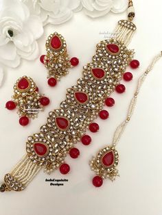 Premium Quality Kundan Pearls Choker Set with Jhumki earrings and Tikka/Indian Jewelry/ High quality kundan Polki jewelry/pearls choker/red  All items are shipped from Brampton, Ontario, Canada. If you need your item by a certain day, please reach out to us for express delivery option before placing the order so that we can update the shipping for you. Standard shipping/delivery timeline Below are the estimated delivery times after the order is shipped/dispatched.  ---> USA delivery timeline * 3 Luxury Red Kundan Necklace For Formal Occasions, Luxury Red Kundan Necklace With Intricate Design, Luxury Red Kundan Necklace For Festivals, Luxury Red Kundan Chandbalis, Luxury Red Kundan Jewelry, Red Bollywood Jewelry Sets With Latkans, Red Kundan Necklace With Latkans For Celebration, Red Chandbali Jewelry Sets For Diwali, Red Ruby Jewelry Sets For Diwali