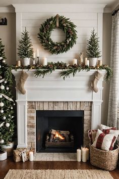 a fireplace decorated for christmas with candles and wreaths