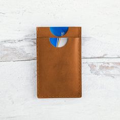 For the minimalist type, our handmade leather money clip features two card pockets and metal money clip. Made from durable buffalo calf, this leather has a smooth finish and will gradually darken and patina beautifully over time. - 2 card slots + Metal Money Clip - Measures approximately 2 3/4" wide x 4 1/2" tall Please note: Each piece is handmade and will vary slightly. Leather may have natural variations and finished markings which add to the character of each piece. Brown Minimalist Card Holder With Rfid Blocking, Minimalist Brown Card Holder With Coin Pocket, Leather Money Clip, Leather Money Clips, The Minimalist, Natural Tan, Handmade Leather, Money Clip, Leather Handmade