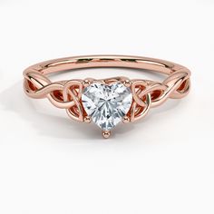 Heart Cut Entwined Celtic Love Knot Ring Diamond Engagement Ring - 14K Rose Gold. The entwined lovers knot is a Celtic symbol of everlasting devotion. Customize this graceful engagement ring with various metals, center diamond shapes, and carats. 14k Rose Gold Heart Cut Jewelry For Wedding, Elegant 14k Rose Gold Jewelry For Valentine's Day, Modern Twist Rose Gold Promise Jewelry, Modern Twist Rose Gold Jewelry For Anniversary, Love Knot Diamond Ring, Celtic Wedding Ring Sets Brilliant Earth, Celtic Knot Ring Engagement, Celtic Engagement Rings Brilliant Earth, Rainbow Topaz Heart In Celtic Knot Ring